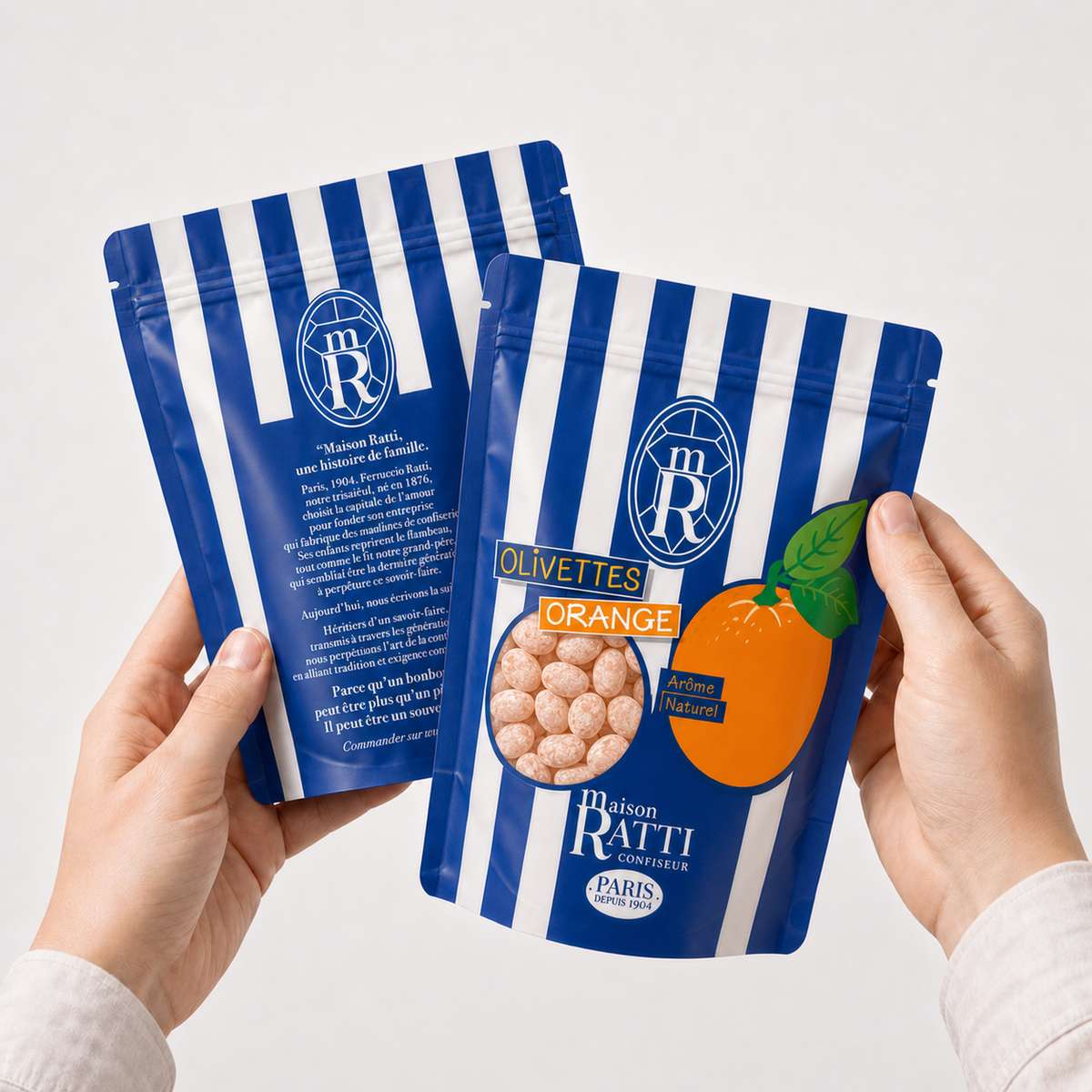 Maison Ratti Olivette Orange, held in the hands