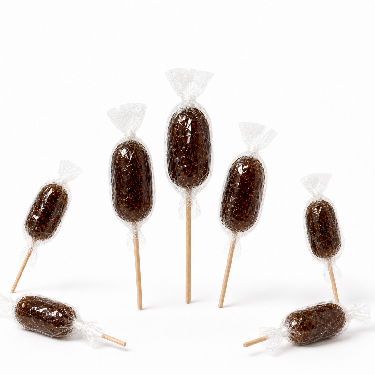 Maison Ratti Cola Lollipop, held in the hands