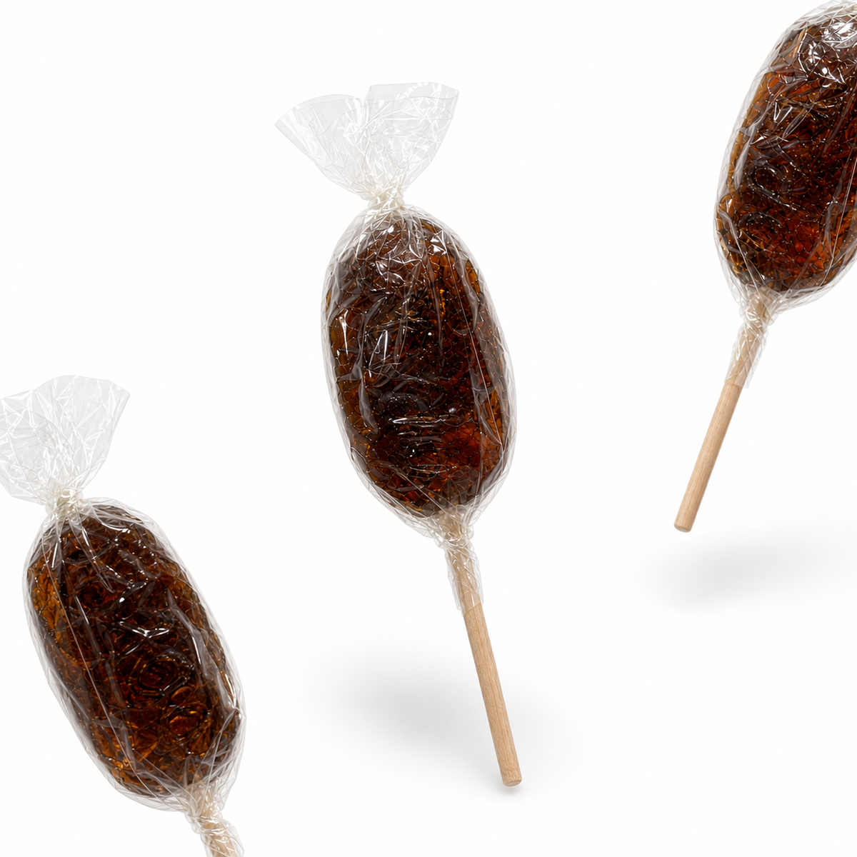 Maison Ratti Cola Lollipop, pouches in a styled scene